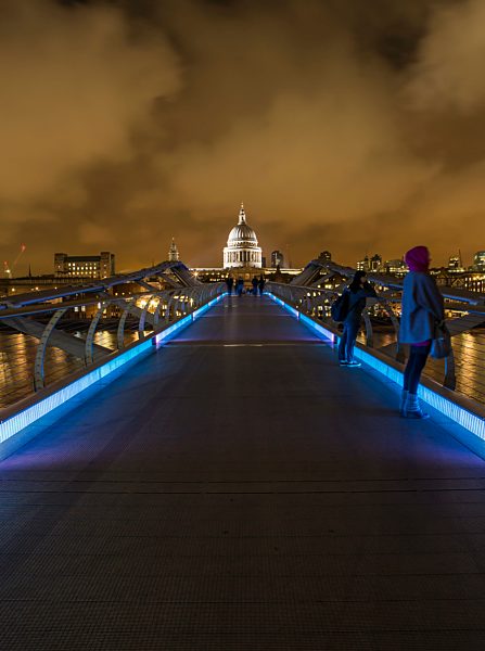 UK, London, view from Millennium Bridge to illuminated St Pauls Cathedral