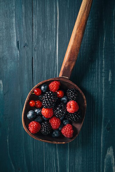 Berries in wooden scoop