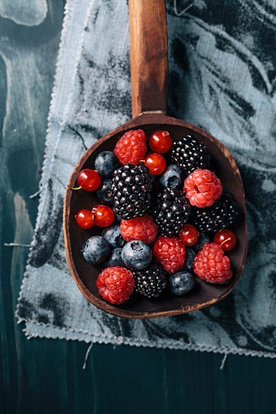 Berries in wooden scoop