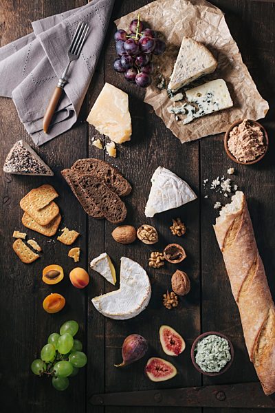 Cheese platter with fruits and nuts
