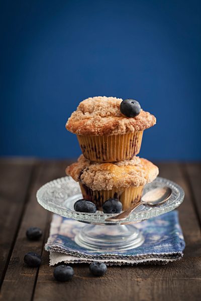 Blueberry muffins on cake stand, close-up