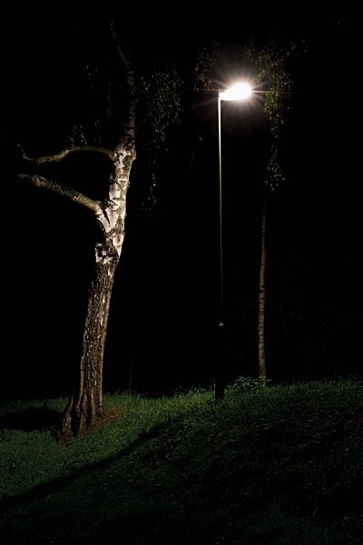 Germany, North Rhine-Westphalia, Neuss, sidewalk in a park by night,