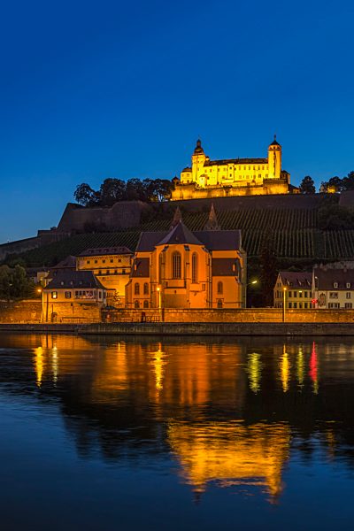 Germany, Bavaria, Wuerzburg, view of Fortress Marienberg and chapel at nightfall