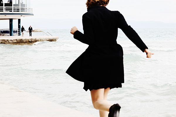 Croatia, Split, Running woman at Bacvice beach