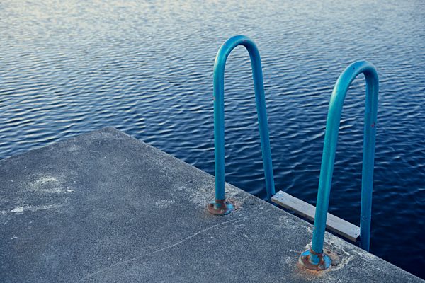 Sweden, Storuman, Ladder at swimming lake