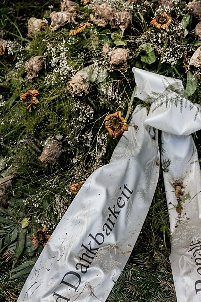 Austria, Upper Austria, Linz, Funeral wreath with ribbon