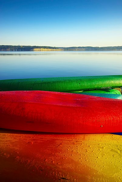 USA, Washington, View of colourful canoes at sea