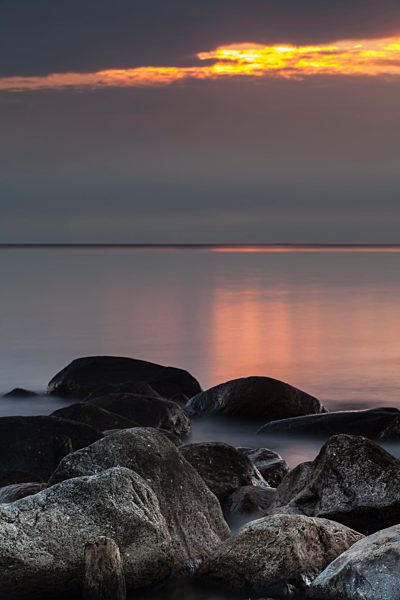 Germany, Baltic Sea, Bay of Luebeck, stones in the evening