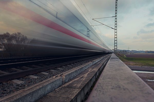 Germany, fast moving train in landscape