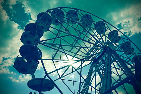 Germany, big wheel in front of cloudy sky, partial view from below