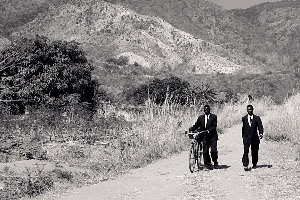 Malawi, Chitimba, Livingstonia, two men wearing suits on the way to sunday mass