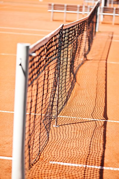 Germany, Munich, Net at tennis sand court