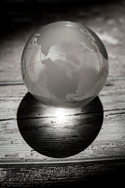Globe glass ball on wooden ground
