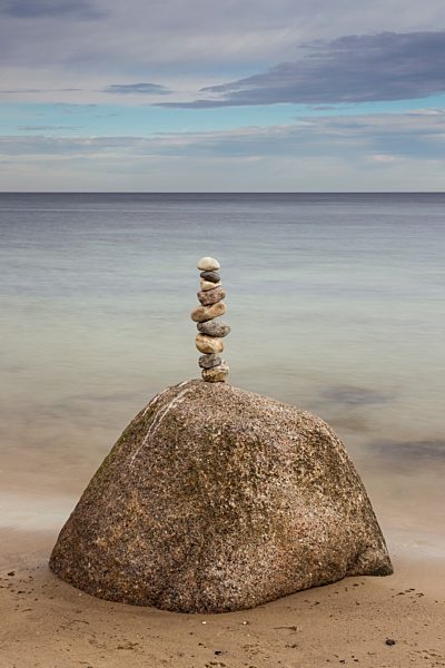 Germany, Brodten, Pile of rocks at beach