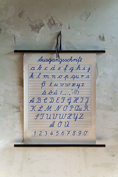 Germany,  Bavaria, Old school board on rough wall