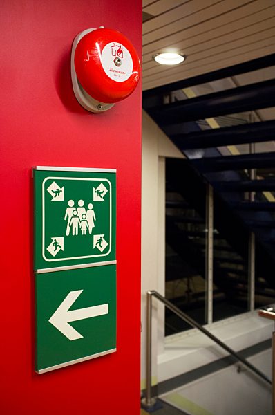 Sign post and alarm bell at ferry