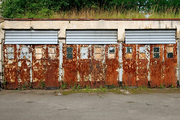 Germany, Brandenburg, Wustermark, Olympic village 1936, view to rusted garage doors