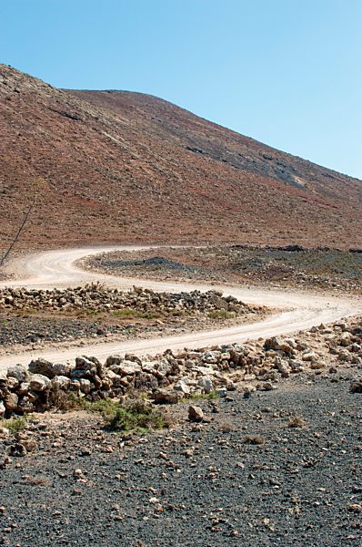 Spain, Fuerteventura, road in between volcanic landscape