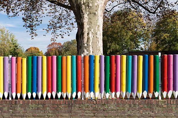 Germany, North Rhine-Westphalia, Duesseldorf-Niederkassel, coloured fence of kindergarten