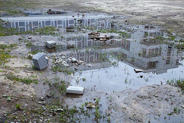 Puddle with reflection of a building