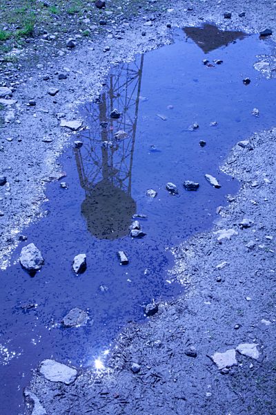 Germany, North Rhine-Westphalia, Dortmund-Hoerde, puddle with reflection of a water tower