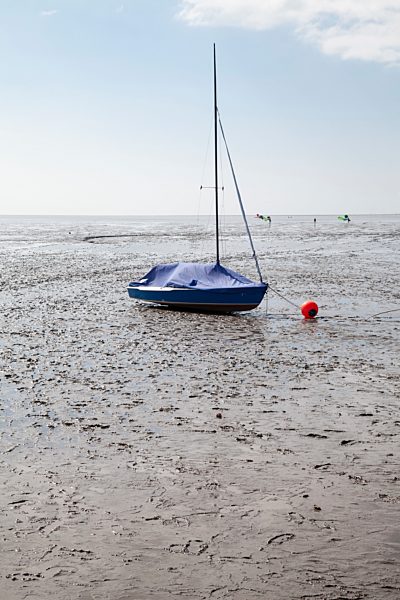 Germany, Lower Saxony, East Friesland, Norddeich, boat in tideland