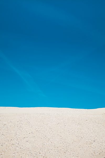 Germany, Lower Saxony, Baltrum, view to the blue sky with beach dune in the foreground