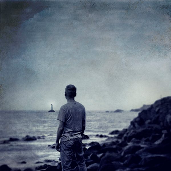 Spain, Canary Islands, La Palma, Puerto Naos, man watching the sea