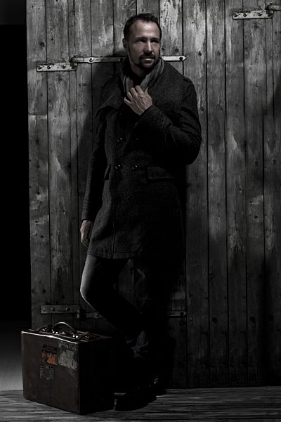 Mature man looking away with briefcase