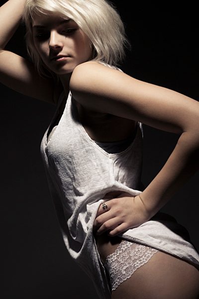 Young woman looking down, close up