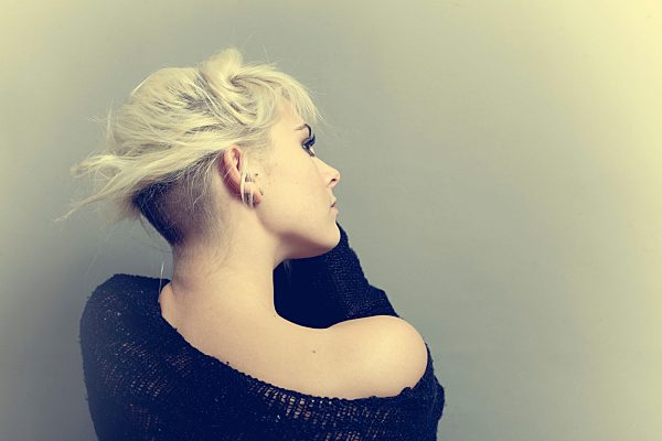 Young woman looking away, close up