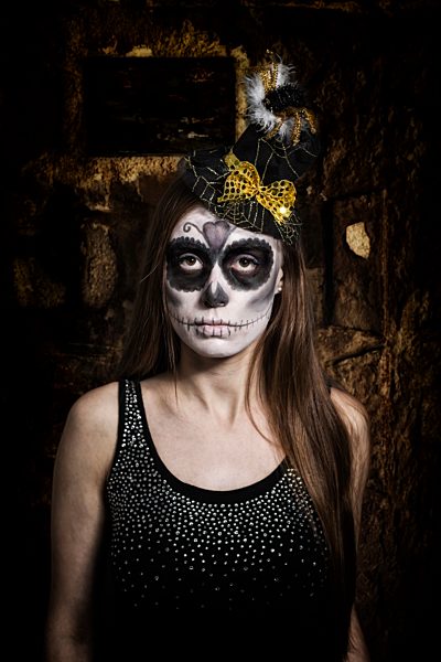 Portrait of woman with skull make-up, studio-shot