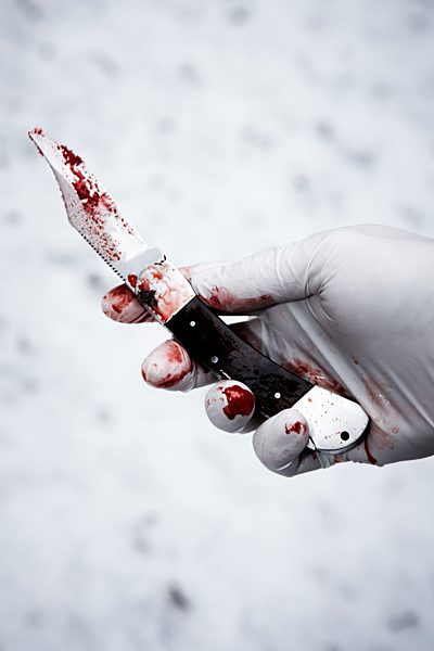 Hand with bloody knife