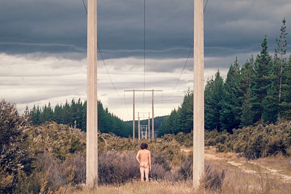 New Zealand, South Island, near Highway 6, Rear view of nude man