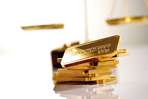 Gold bars in background a letter scale