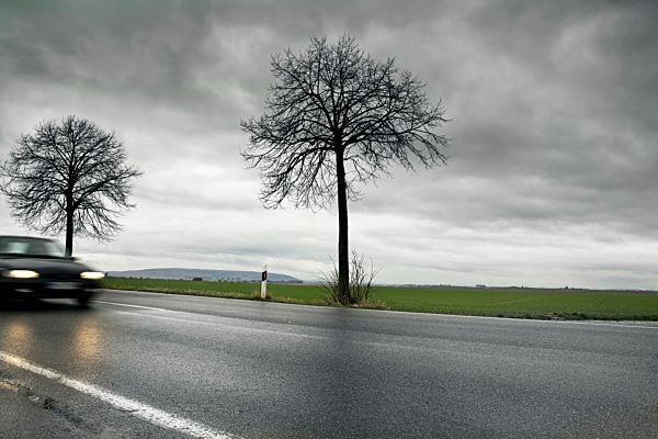 Germany, Car passing through country road