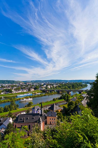Germany, Rhineland Palatinate, Trier, Excursion boat in Mosel River with cityscape