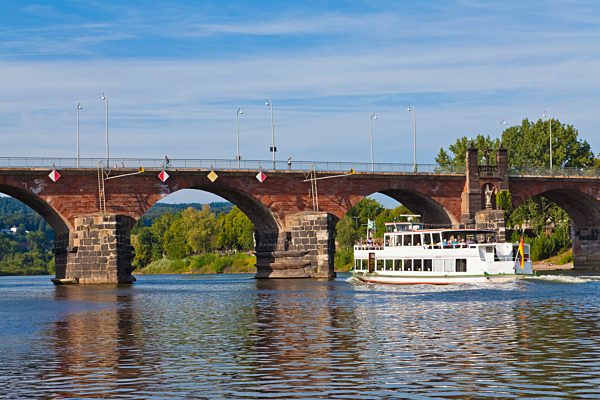 Germany, Rhineland Palatinate, Trier, Excursion boat in Mosel River with Roman Bridge