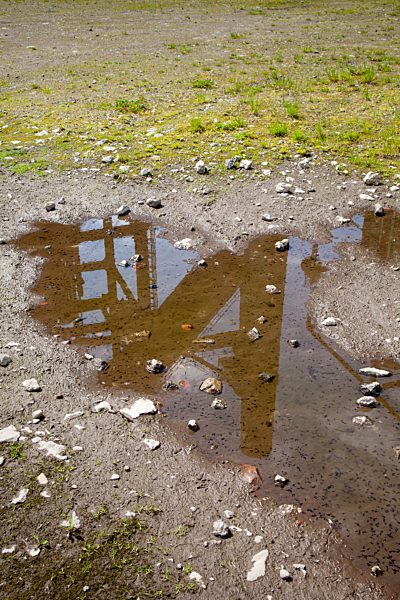 Germany, North Rhine-Westphalia, Dortmund-Hoerde, puddle with reflection of part of a blast furnace