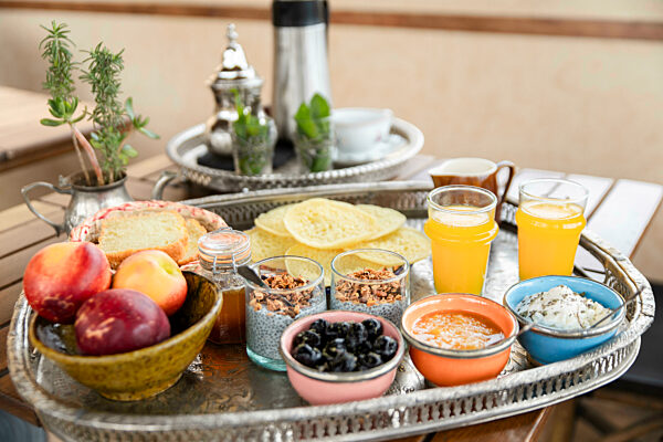 Fresh breakfast tray on hotel terrace in Fez Morocco with relaxed atmosphere