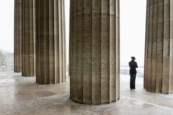 Germany, Bavaria, woman standing between columns of Walhalla