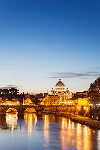 Italy, Rome, St. Peter's Basilica and Ponte Sant'Angelo in the evening