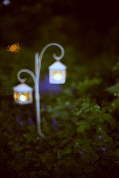 Blurred image of iron lantern burning at night