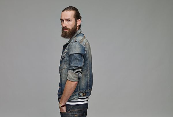 Portrait of man with full beard wearing jeans jacket