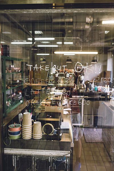 Japan, information on glass pane of a coffee shop