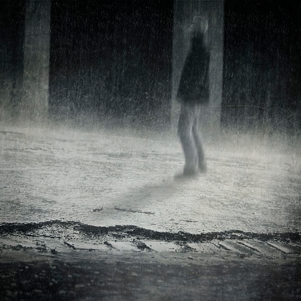 Germany, Wuppertal, man standing in the rain