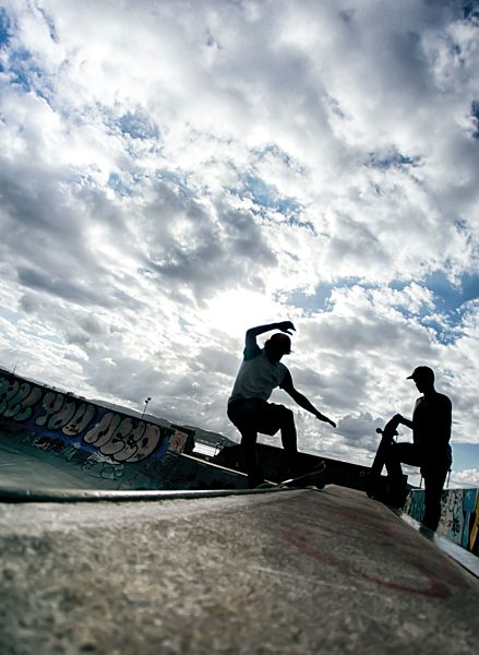 Young man skateboarding in a skatepark