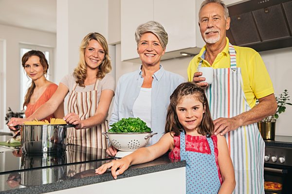 Portrait of extended family in the kitchen