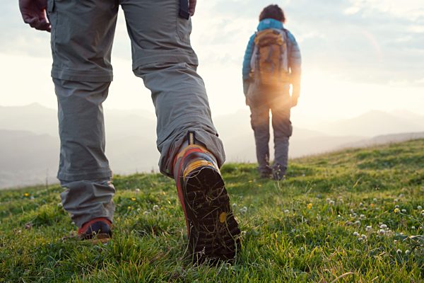 Austria, Tyrol, couple hiking at Unterberghorn at sunrise