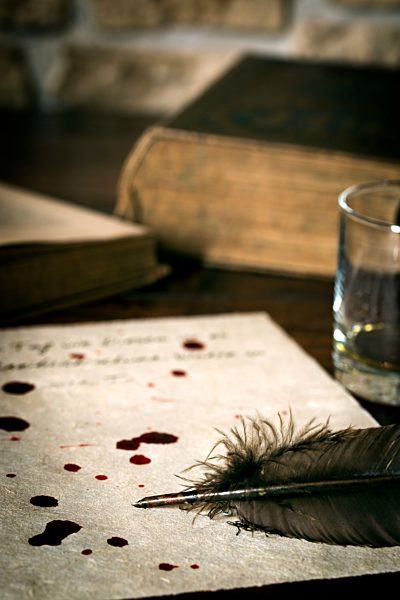 Suicide letter on parchment paper with blood drops and quill
